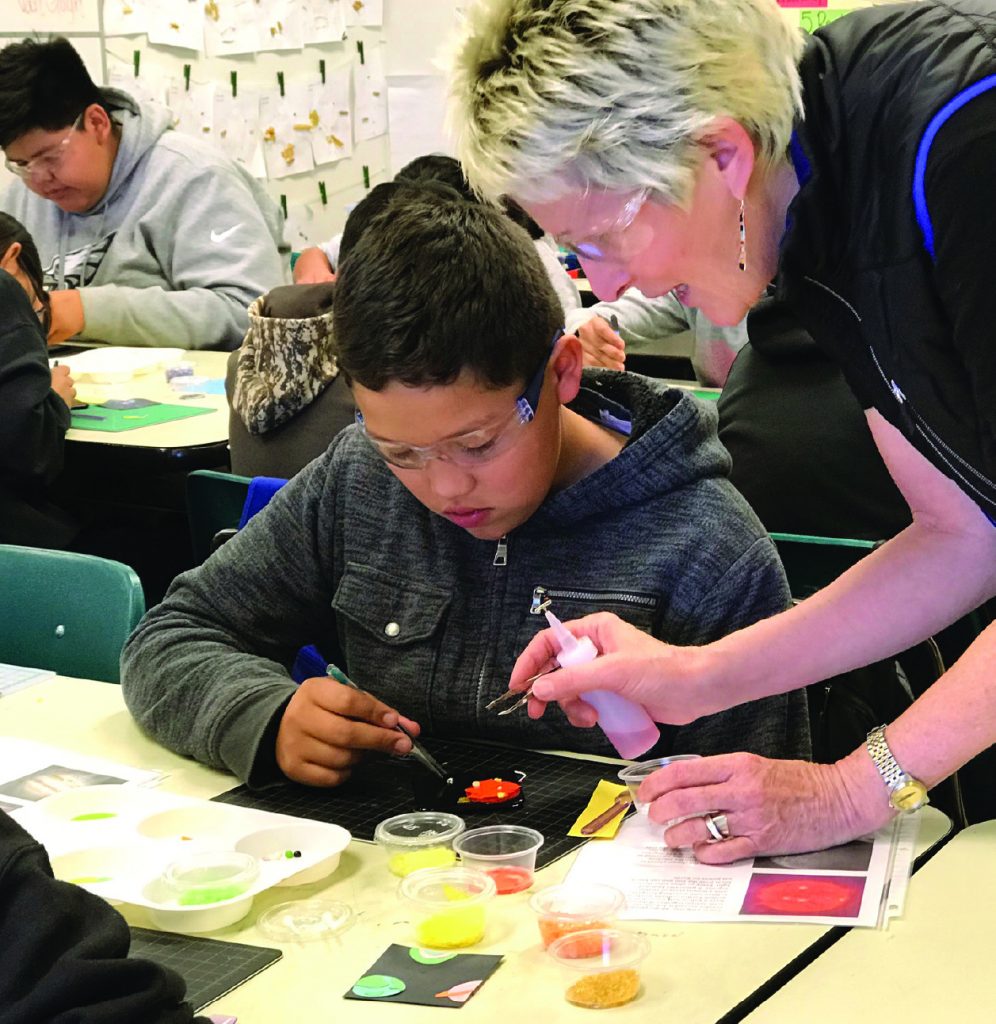 Artist Connie Trenholm working with Montezuma Creek Elementary students.