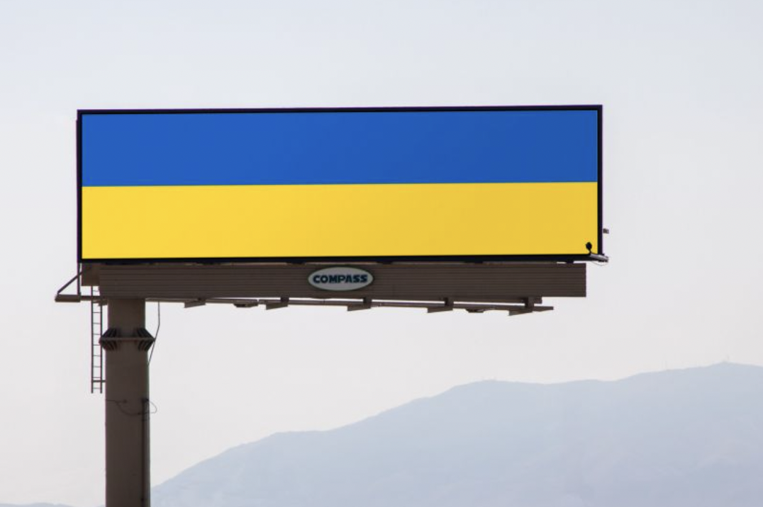 The stripes of the Ukranian flag fly from a Lehi billboard.